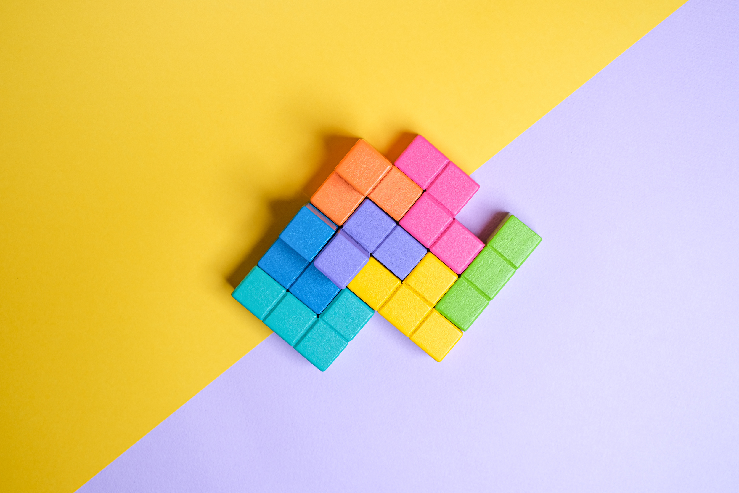 Building Blocks on Yellow and Lilac Background